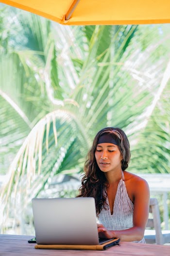 Woman Using Silver Laptop
