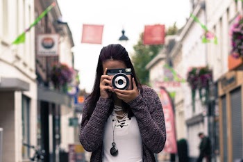 Woman Using Slr Camera Outdoors