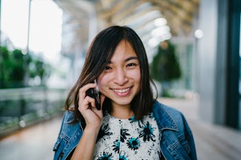 Woman Using Smartphone Inside Building