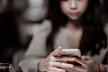 woman using smartphone shallow focus