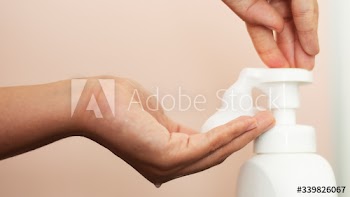 Woman using soap to clean hands and prevent coronavirus