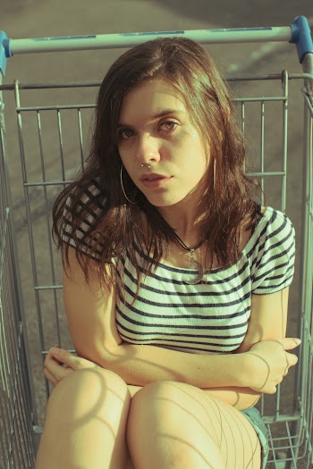 Woman Waering White and Black Striped Blouse