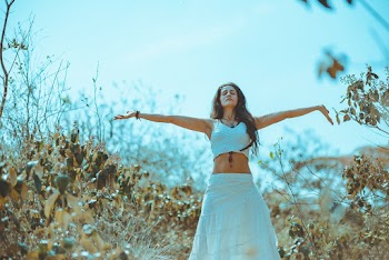 Woman Waering White Bra and Maxi Skirt