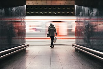 Woman Waits Train Speeds By
