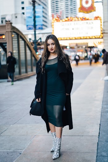 Woman Walking Along a Street