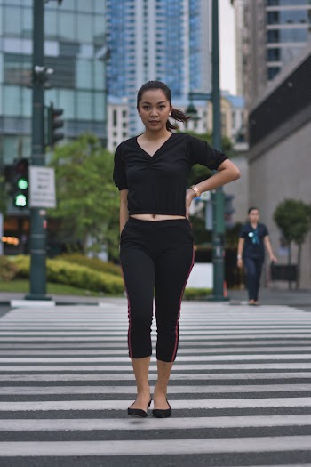 Woman Walking Along Pedestrian Lane