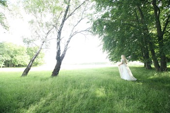 Woman Walking Behind Trees