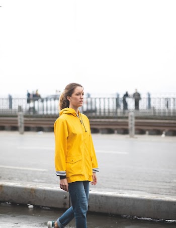 Woman Walking Beside River
