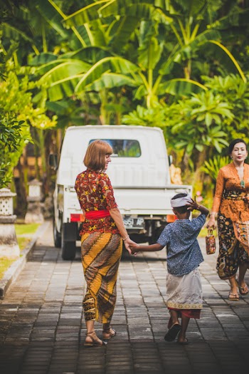 Woman Walking Holding Hand Boy