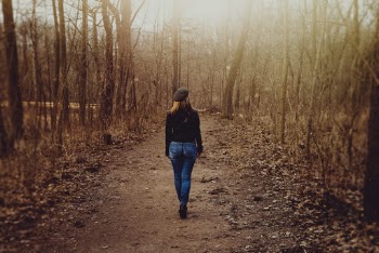 Woman Walking in the Forest
