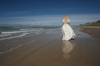 Woman Walking Near Shore