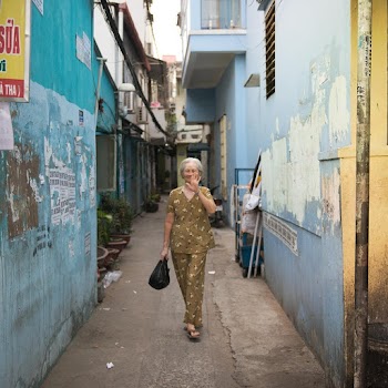 Woman Walking on Alley