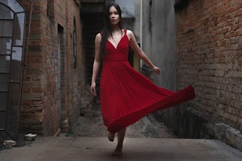 Woman Walking on an Alley