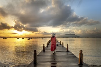 Woman Walking On Beach Dock