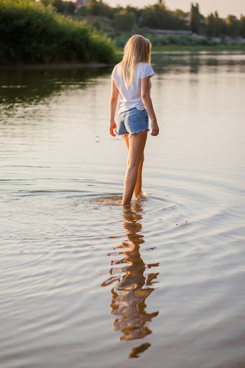 Woman Walking on Body of Water
