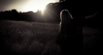woman walking on grass field