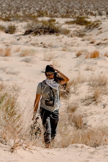 Woman Walking On Open Field