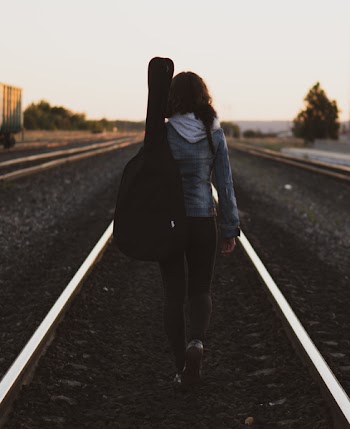 Woman Walking on Road
