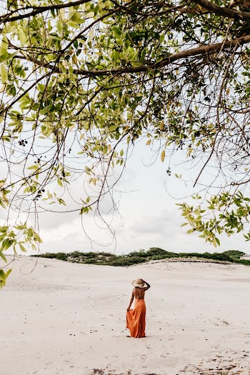 Woman Walking On Sand