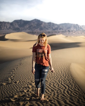 Woman Walking on Sand Dunes
