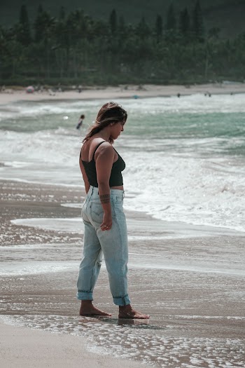 Woman Walking on Seashore