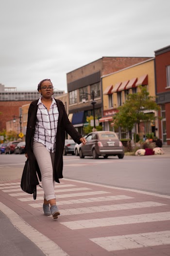 Woman Walking on Street Wearing Black Cardigan