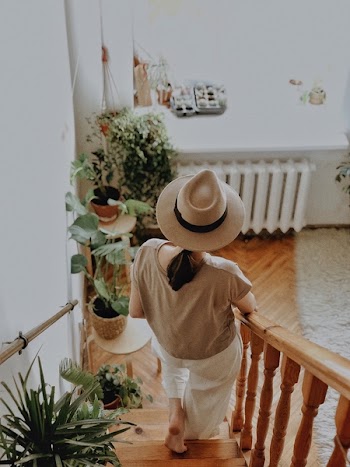 Woman Walking on Wooden Stair