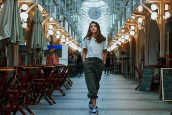 Woman Walking With Both Hand on Pocket