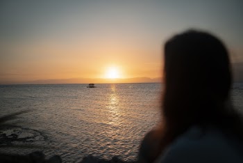 Woman Watching The Sunset