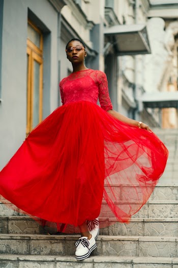 Woman Wear Red Elbow-sleeved Dress Walking on Stair