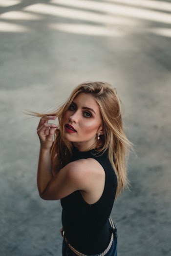 Woman wearing a black sleeveless top