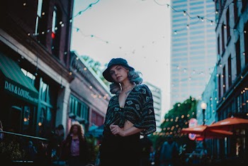 Woman Wearing A Bucket Hat