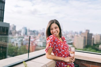 Woman Wearing a Floral Dress with the a Rooftop View