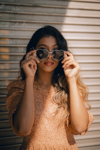 Woman Wearing A Heart-Shaped Sunglasses