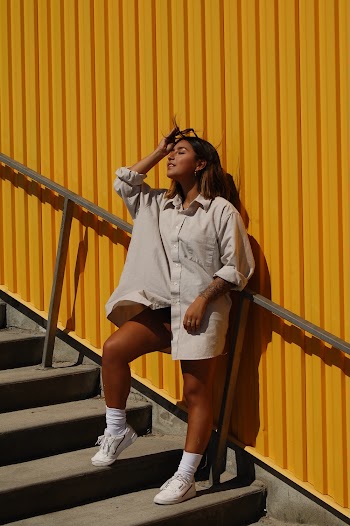 Woman Wearing a Long-sleeved Shirt Posing on Stairs