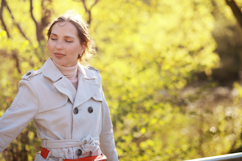 Woman wearing a trench-coat