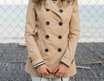 Woman wearing a trench-coat
