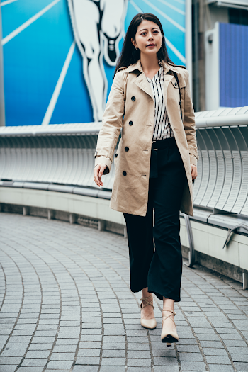 Woman wearing a trench-coat
