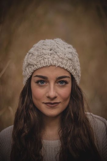 woman wearing a white beanie