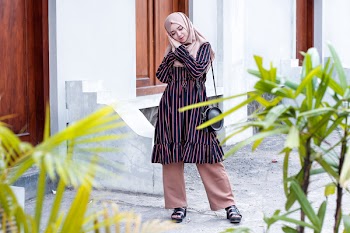Woman Wearing Abaya Dress and Standing on Ground