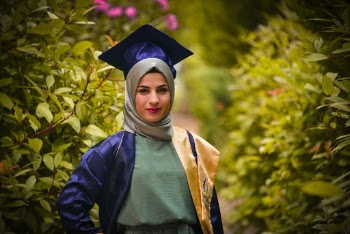 Woman Wearing Academic Dress and Mortar Board