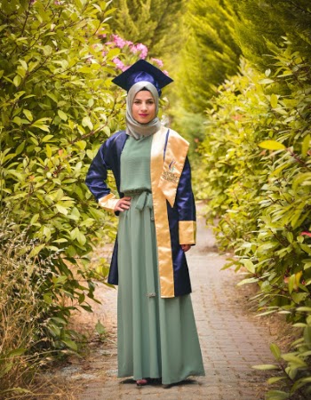 Woman Wearing Academic Dress and Mortarboard