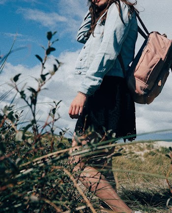 Woman Wearing Backpack Near Plants