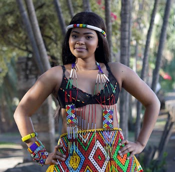 Woman Wearing Beaded Dress Looking at Camera