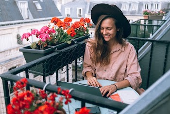 Woman Wearing Beige Dress Shirt Using Laptop Computer