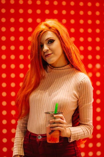 Woman Wearing Beige Knit Sweater