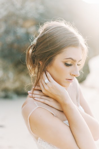 Woman Wearing Beige Sleeveless Top Facing Sideways