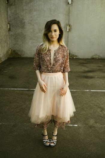 woman wearing beige top and skirt