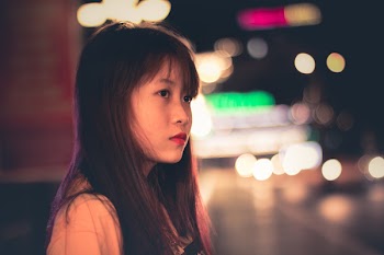 Woman Wearing Beige Tops and Bokeh Light