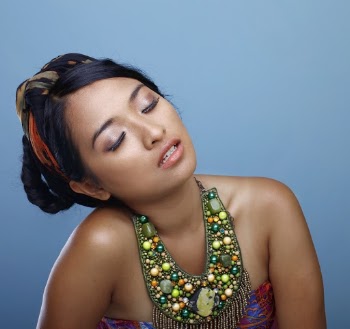 Woman Wearing Bib Necklace And Strapless Top